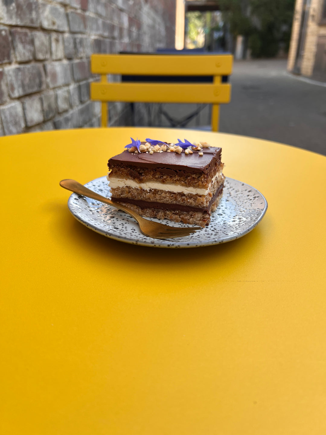 Hazelnut Dream Cake - three slices of hazelnut dacquoise, sandwiched with dark chocolate ganache and white chocolate buttercream