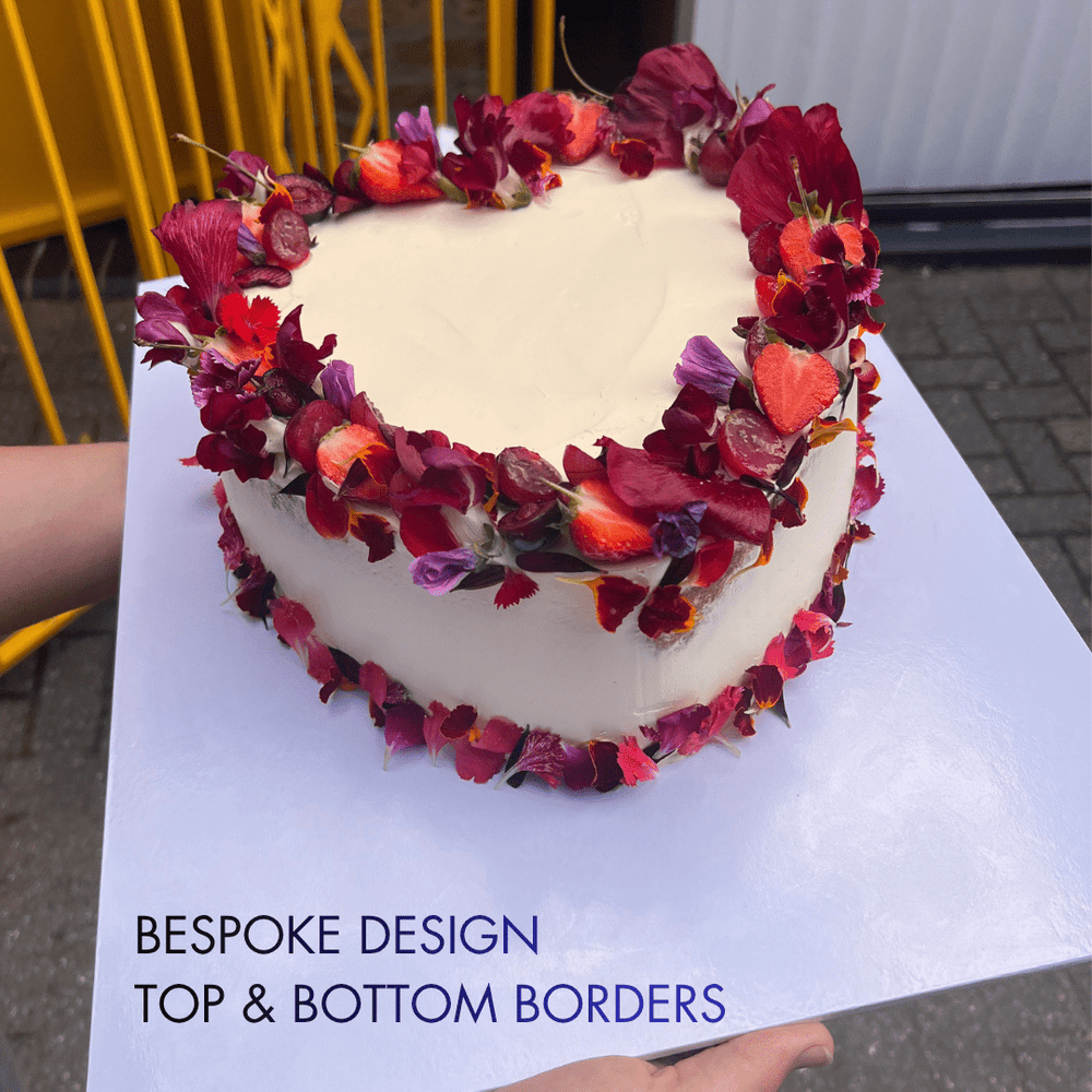 Heart Shaped Engagement Cake decorated with fruits and edible flowers. London