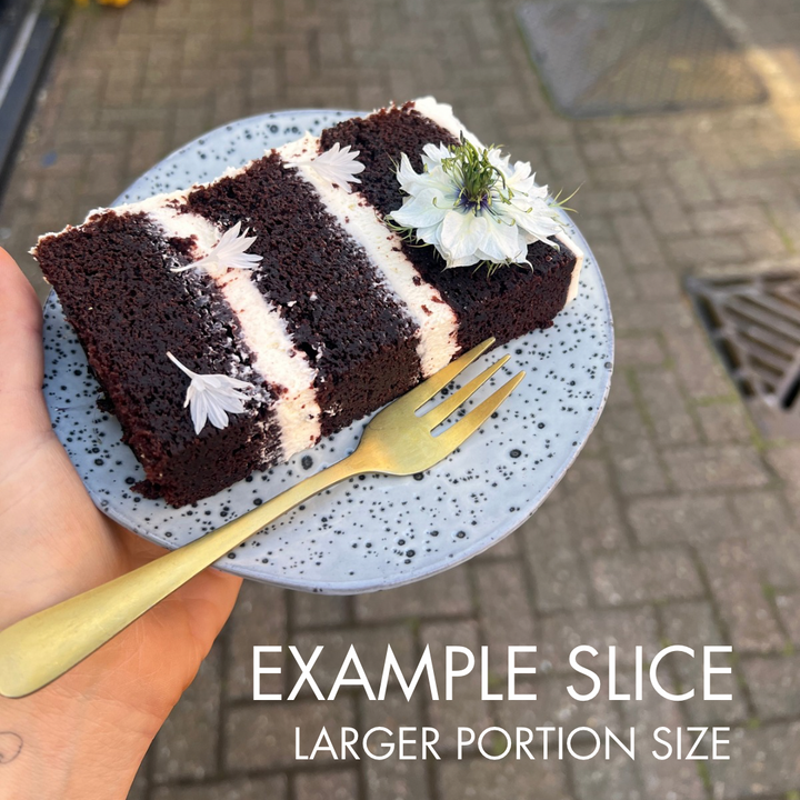 Slice of chocolate Guinness cake with cream cheese filling, three layer