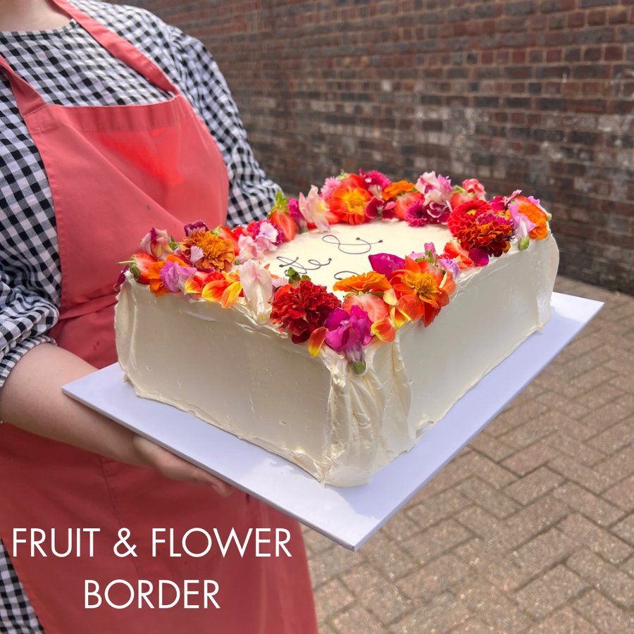 Sheet cake with fruit and flower border decoration, London