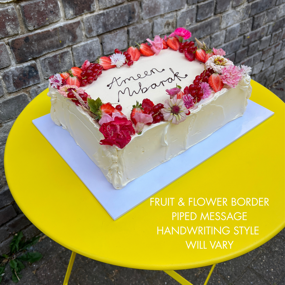 Sheet cake with fruit & flower border, with piped message