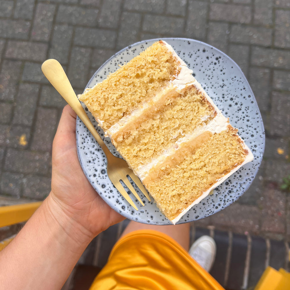 Slice of Sicilian lemon cake showing almond sponge layers and buttercream
