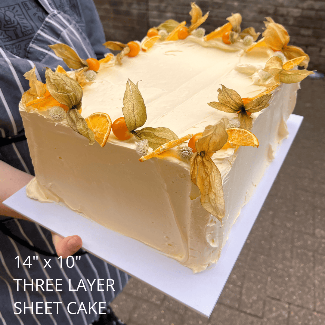 14x10 three layer sheet cake decorated with physalis and orange slices