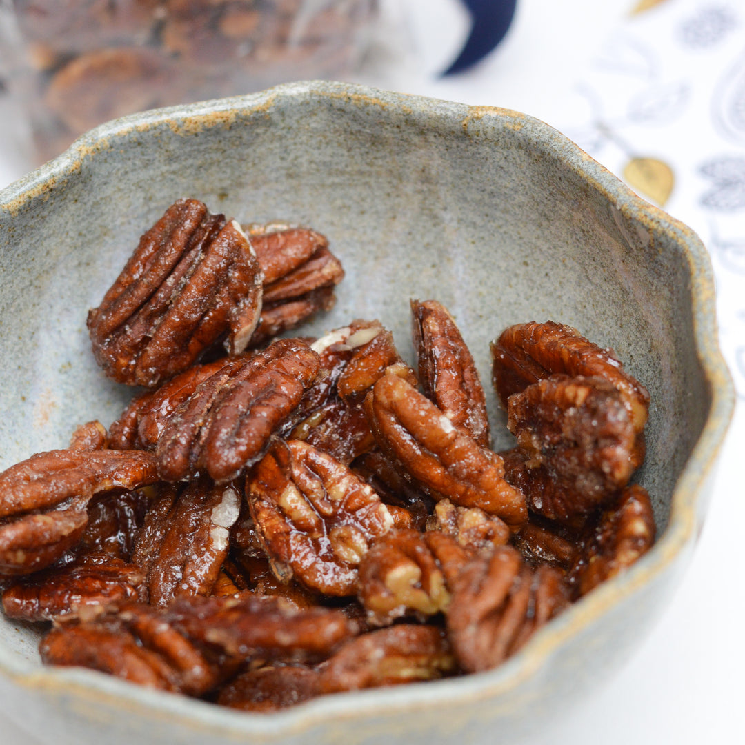 candied pecans in a ceramic bowl