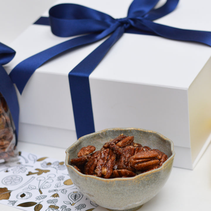 candied pecans in a ceramic bowl